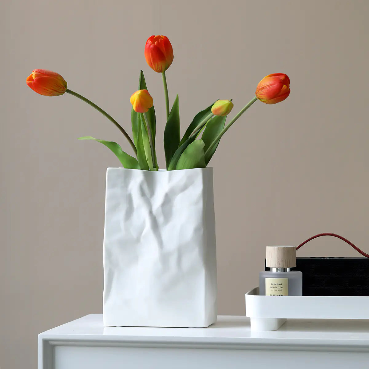 Stylish ceramic flower vase with vibrant tulips for modern home decor