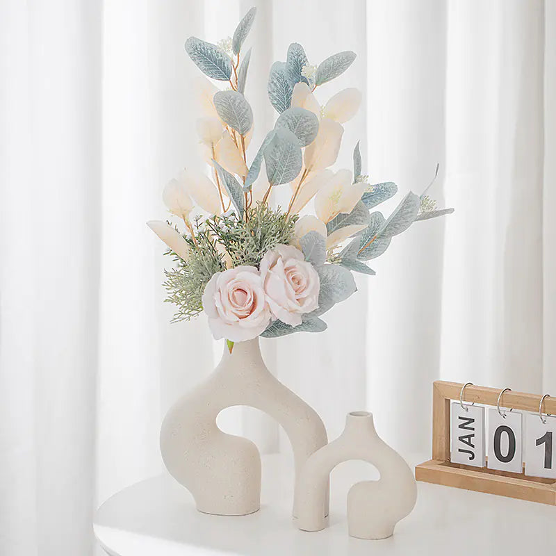 Nordic ceramic vase decor featuring a unique design with flowers and greenery arrangement