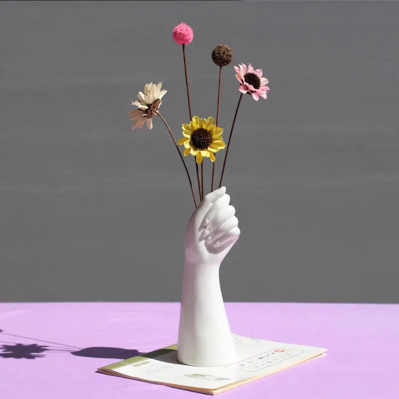 Stylish Nordic vase with dried flowers in a hand design, perfect for home decor accents