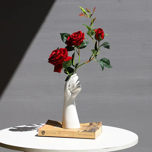 Nordic vase with dried flowers featuring a unique hand design and red roses for elegant home decor