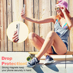 Woman using a MagSafe ring stand for iPhone outdoors for secure phone grip and drop protection