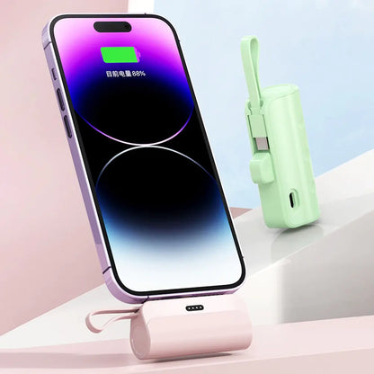Wireless capsule mini power bank charging a smartphone with a stylish design and sleek colors